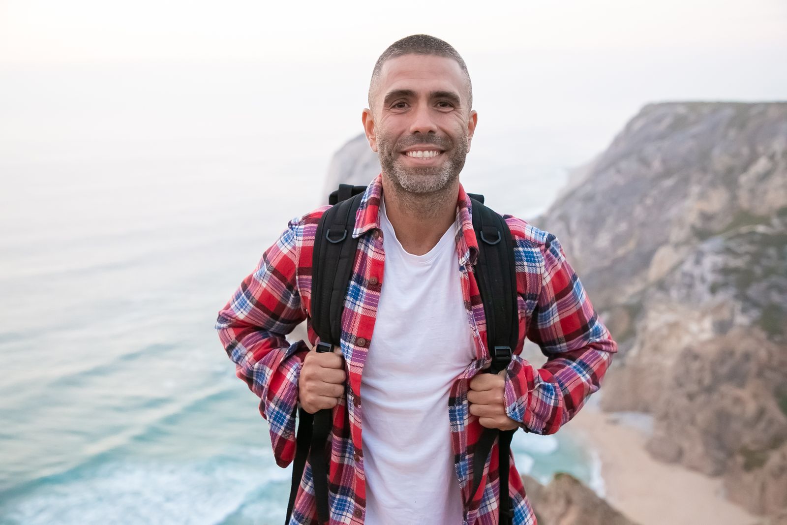 An adult hiking on a forest trail